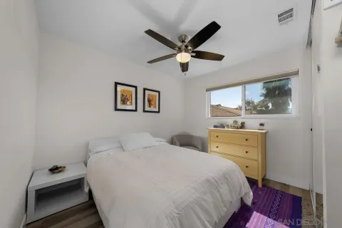 a bedroom with a bed and a dresser