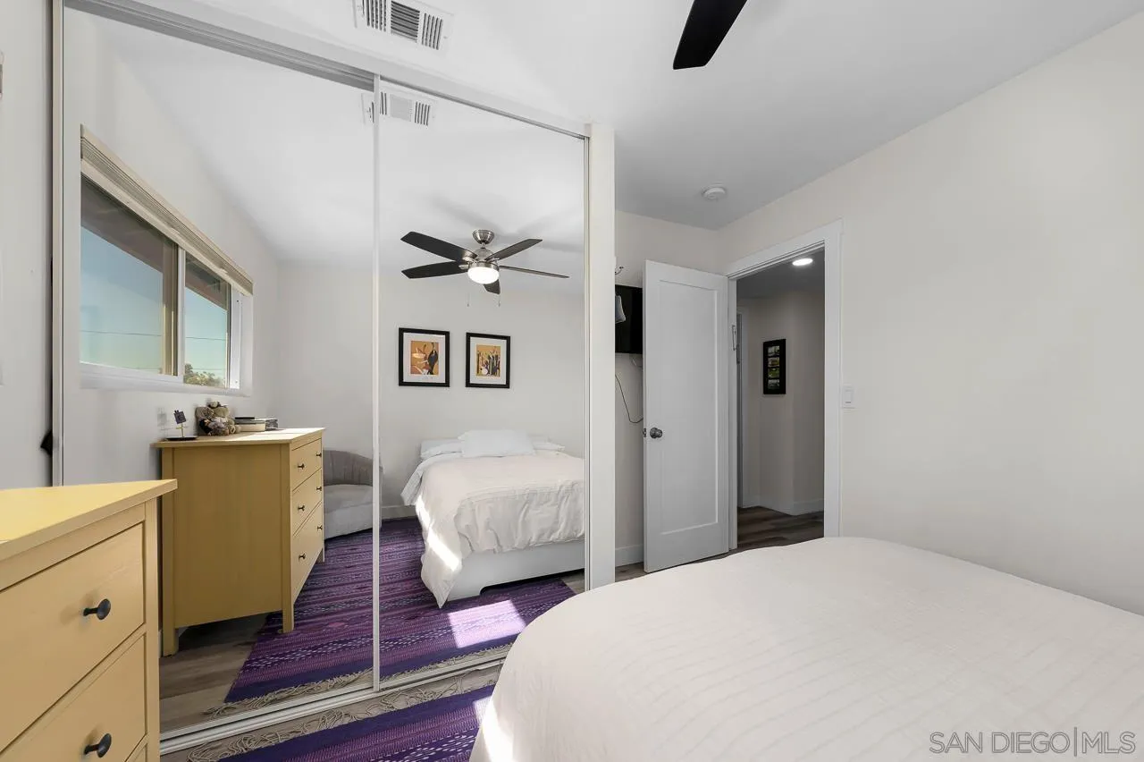 1761 Harvard Street Chula Vista, CA 91913 - Photo 27 of 41 a bedroom with bed and wooden floor