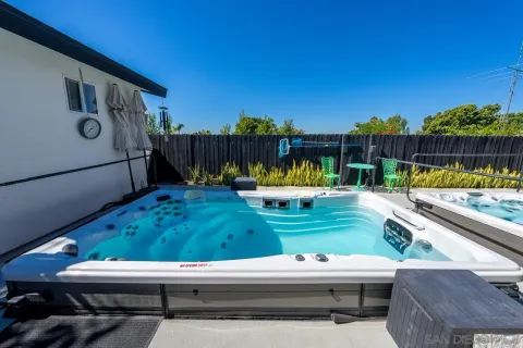a view of a chairs and table in patio