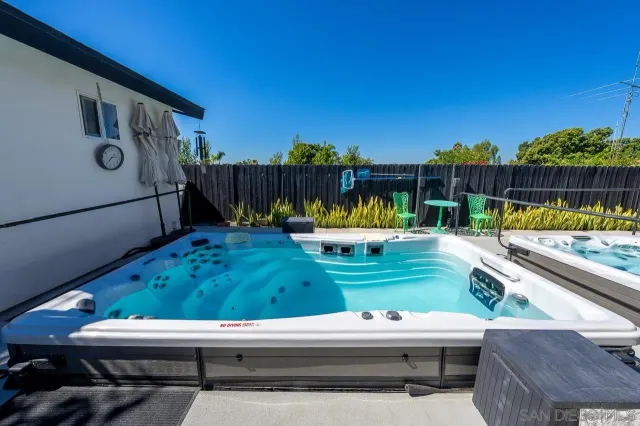 a view of a chairs and table in patio