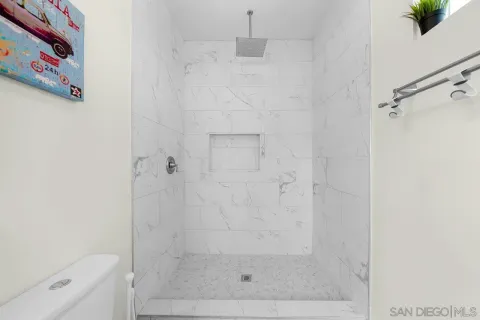 a view of a patio with a table chairs and a umbrella