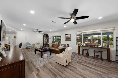 a living room with furniture and a large window