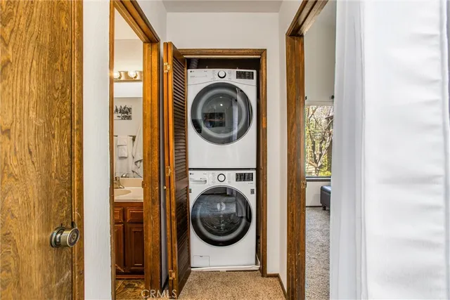 a view of livingroom with washer and dryer