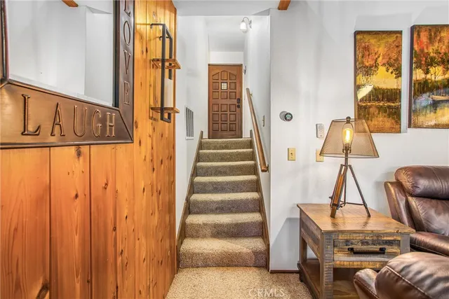 a view of an entryway with wooden floor and door