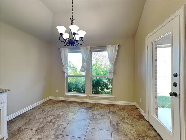 a view of a chandelier in a room with a chandelier