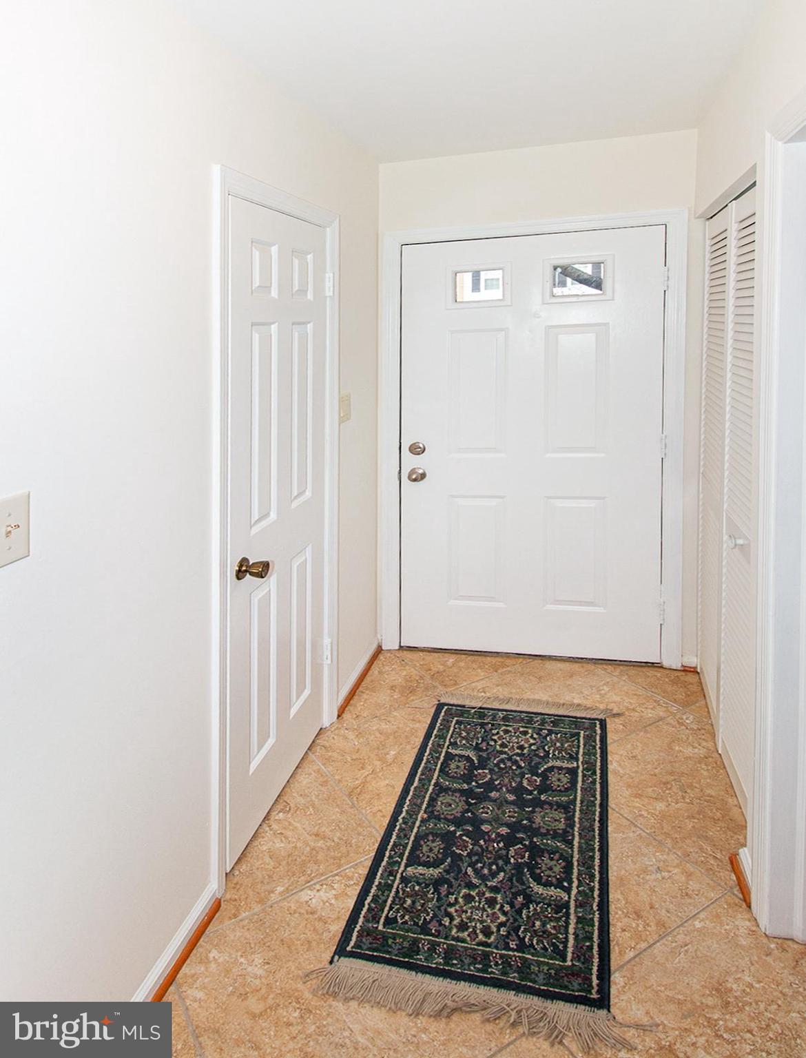 5619 Ridge View Drive Alexandria, VA 22310 - Photo 3 of 36 Entry Foyer w/coat closet, half bath, tile floor