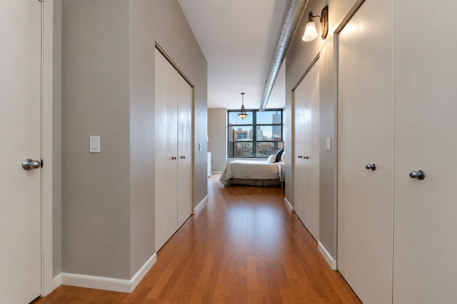 1200 West Monroe Street, Unit 502 Chicago, IL 60607 - Photo 10 of 20 a view of a hallway view with wooden floor and staircase