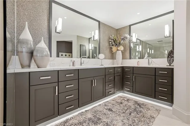 a spacious bathroom with a sink mirror and a shower