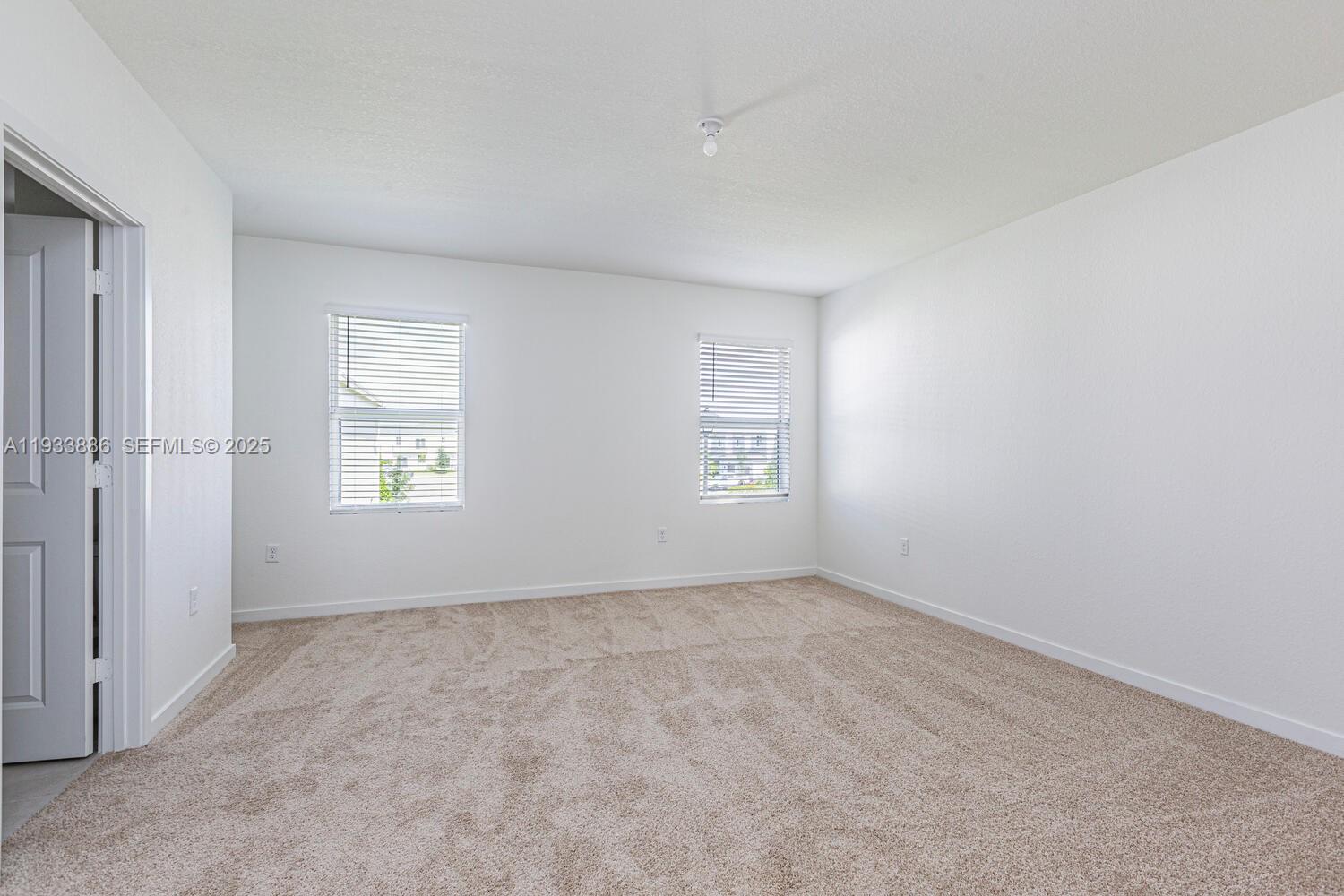 1780 Southeast 9th Avenue Homestead, FL 33034 - Photo 7 of 20 an empty room with windows