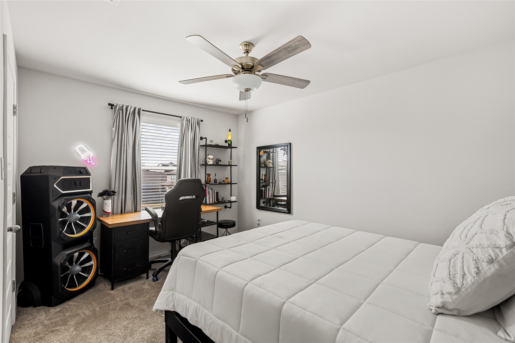 862 Pepperbark Loop Buda, TX 78610 - Photo 27 of 40 a bedroom with a bed and a chandelier