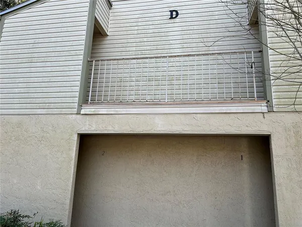 a bathroom with a sink and a refrigerator