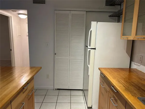 a kitchen with a sink a stove and cabinets