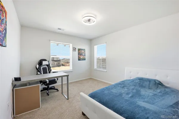 a workspace with furniture and window