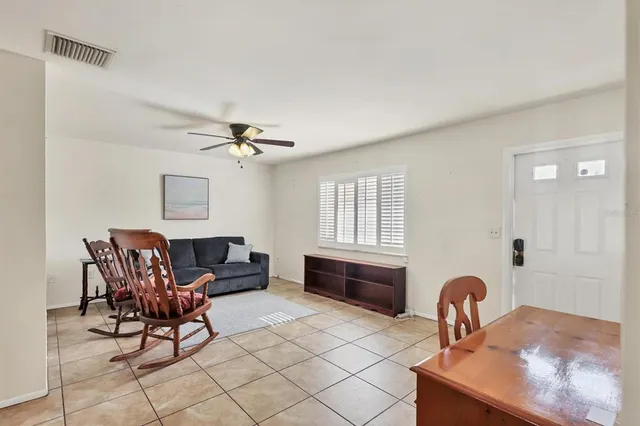 a dining room with furniture and window