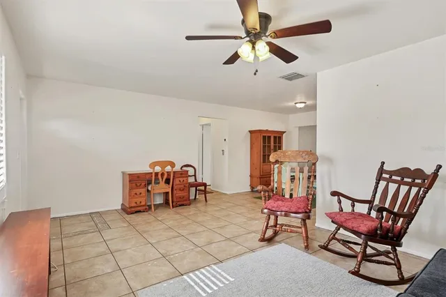 a view of a dining room with furniture and window