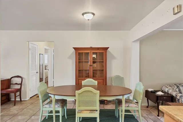 a kitchen with granite countertop a sink a stove and cabinets