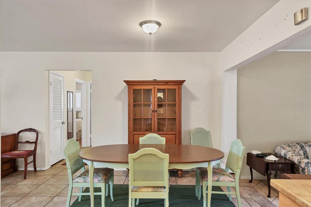 3621 Glen Ridge Lane Sarasota, FL 34233 - Photo 14 of 36 a view of a dining room with furniture and window