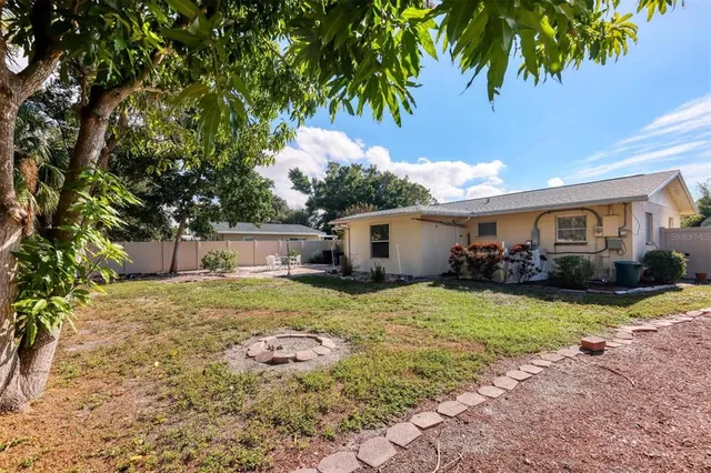 aerial view of a house with a yard