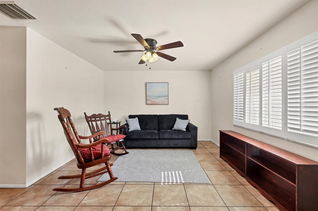 3621 Glen Ridge Lane Sarasota, FL 34233 - Photo 10 of 36 a living room with furniture and a window