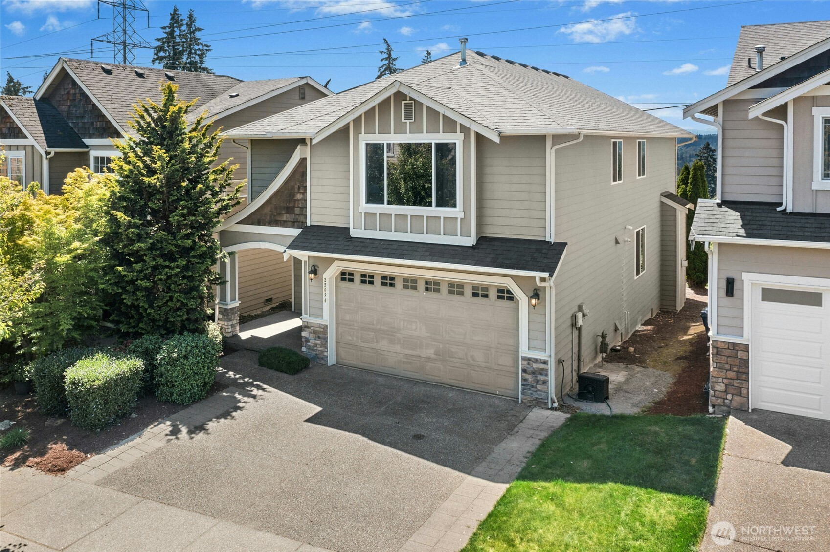 22624 43rd Drive Southeast Bothell, WA 98021 - Photo 30 of 36 a view of a white house next to a yard with potted plants