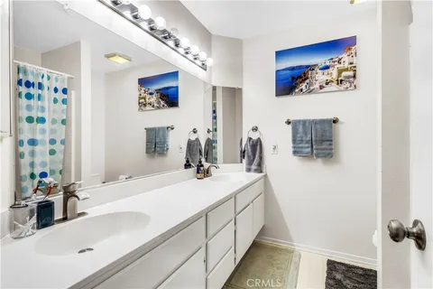 a bathroom with a double vanity sink