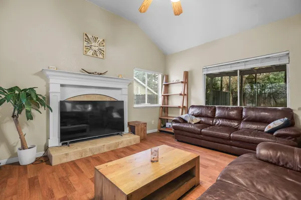a living room with furniture and a fireplace