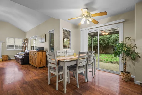 a view of a dining room with furniture window and wooden floor