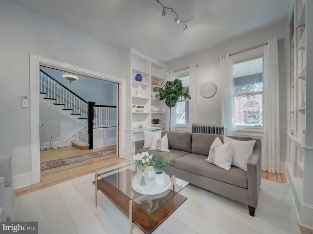 a view of a livingroom with furniture and a window