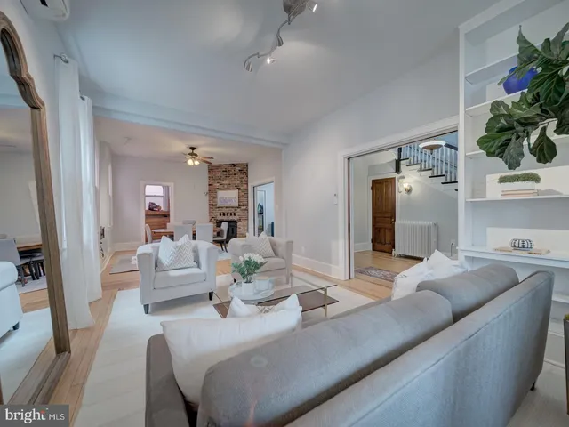a view of a livingroom with furniture and wooden floor