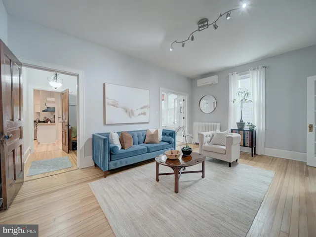 a view of a hallway view with wooden floor and stairs