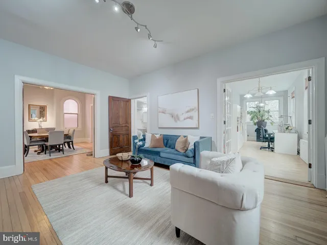 a bed room with a bed and a chandelier