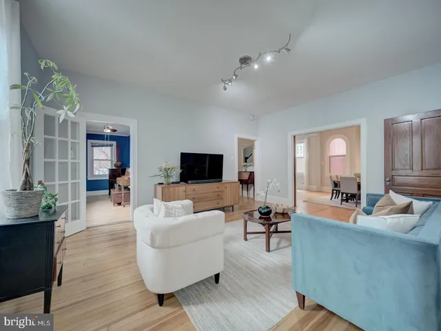 a bedroom with furniture and wooden floor