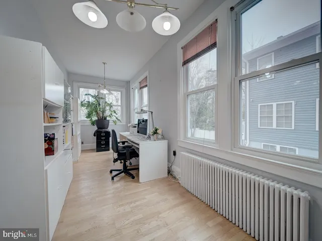 a spacious bathroom with a double vanity sink toilet and a mirror