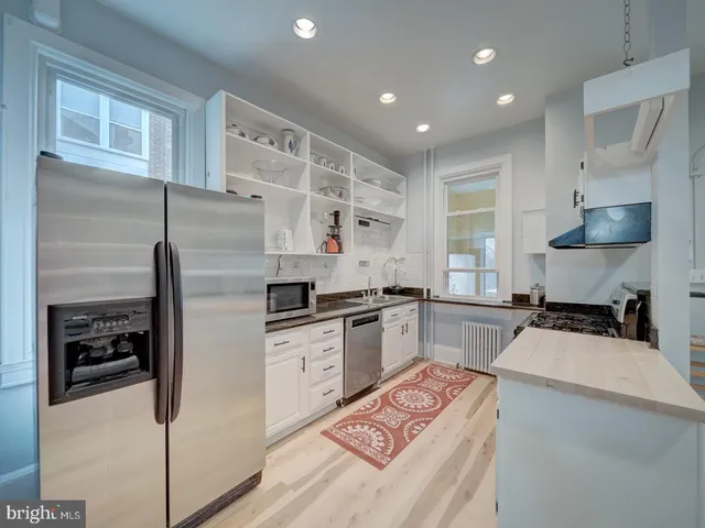 a bathroom with a shower and a sink