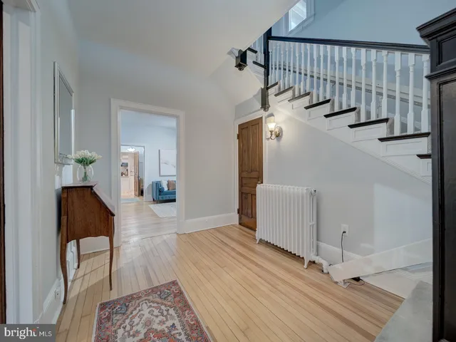 a view of a dining room with furniture and a fireplace