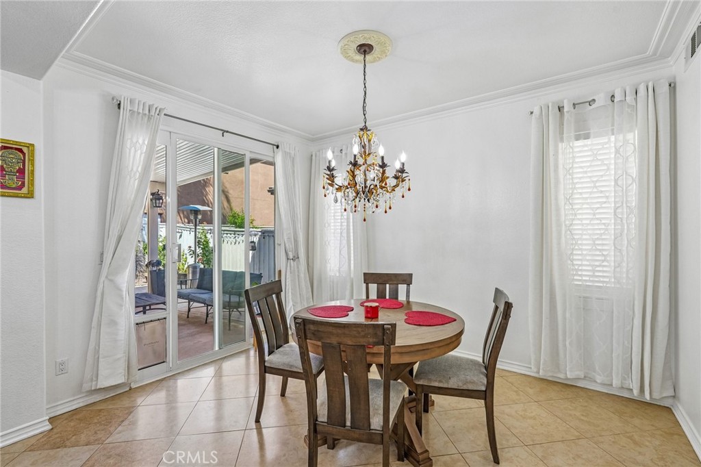 46101 Sharon Street Temecula, CA 92592 - Photo 12 of 34 a view of a dining room with furniture window and outside view