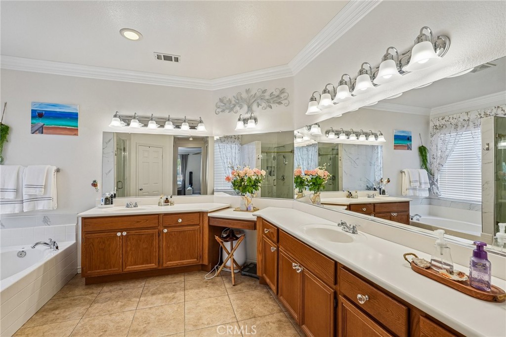 46101 Sharon Street Temecula, CA 92592 - Photo 22 of 34 a large kitchen with a large island and sink