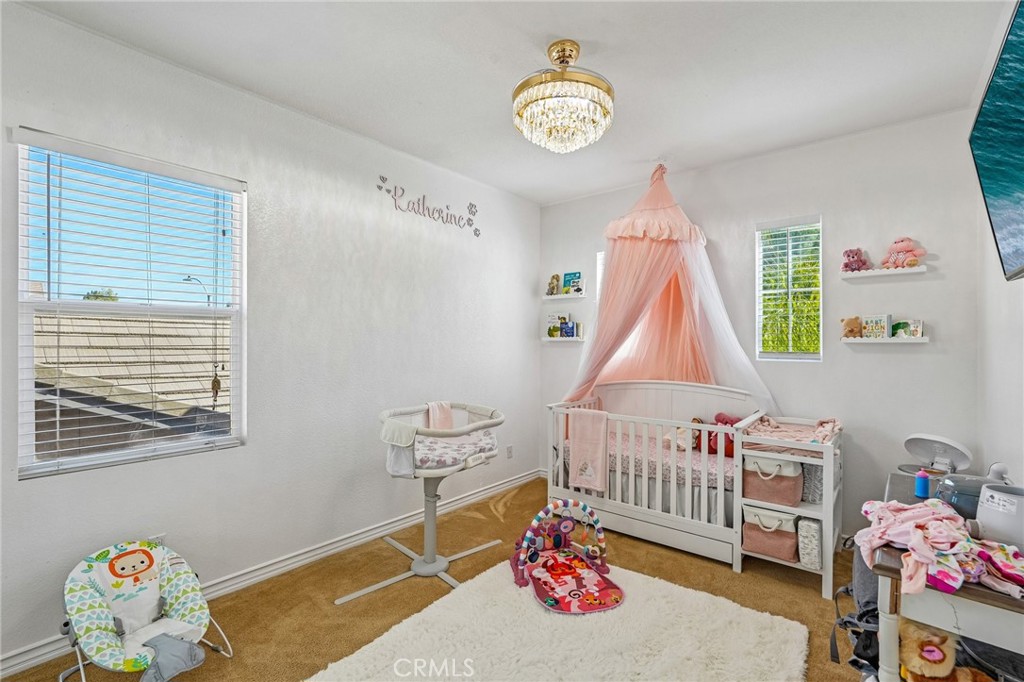 46101 Sharon Street Temecula, CA 92592 - Photo 24 of 34 a bedroom with a bed and a window