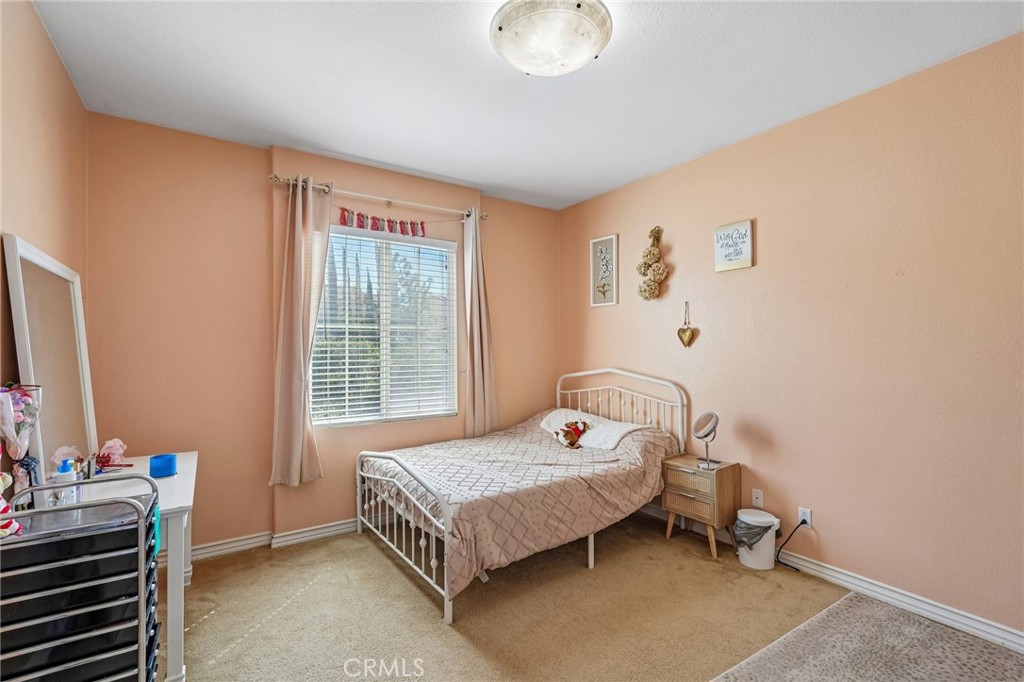 46101 Sharon Street Temecula, CA 92592 - Photo 26 of 34 a bedroom with a bed and a window