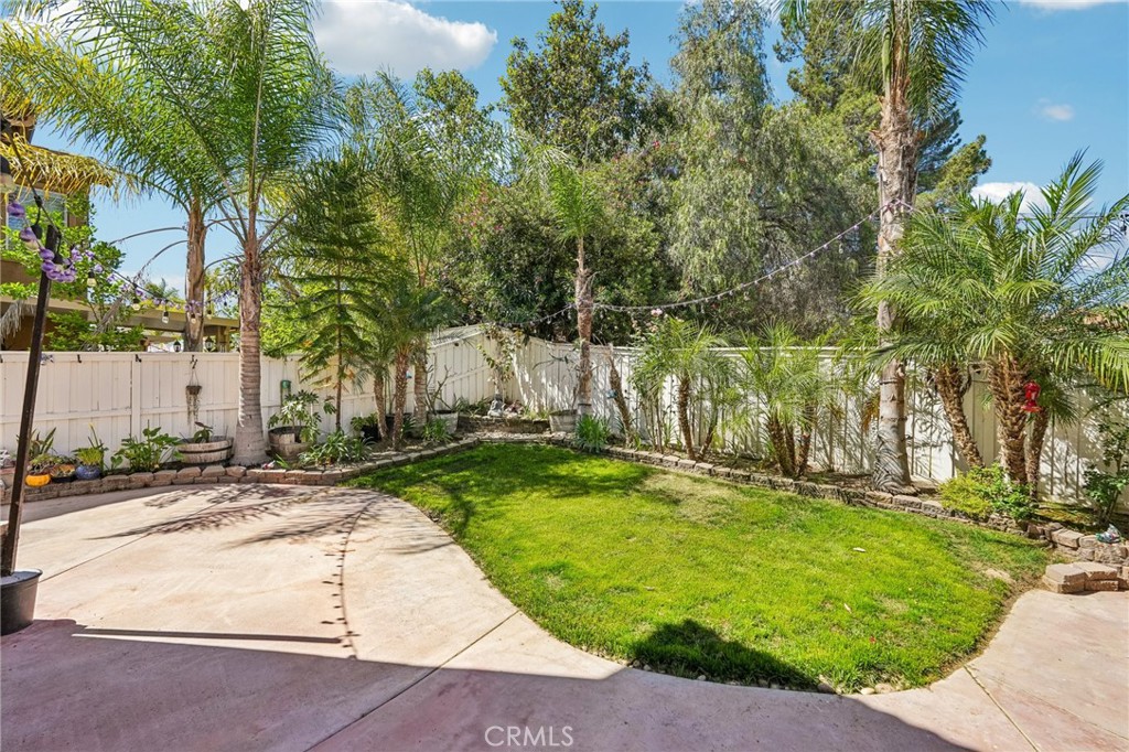 46101 Sharon Street Temecula, CA 92592 - Photo 29 of 34 a backyard of a house with lots of green space