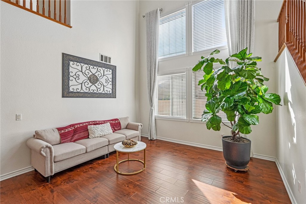 46101 Sharon Street Temecula, CA 92592 - Photo 6 of 34 a living room with furniture potted plant and a window