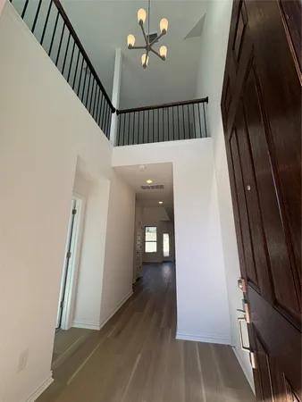 a view of an entryway with wooden floor
