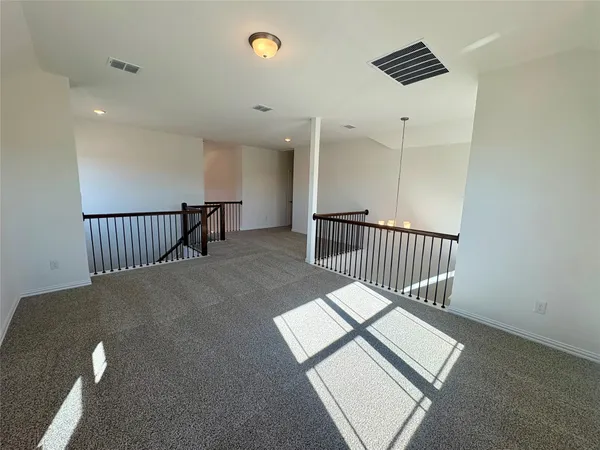 a view of staircase with wooden floor