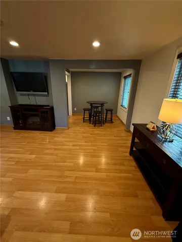 a swimming pool with table and chairs