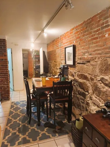 a kitchen with a sink a stove and cabinets