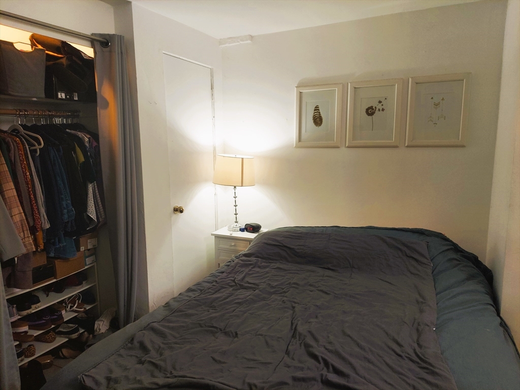 63 Chandler Street, Unit A Boston, MA 02116 - Photo 6 of 9 a bedroom with a bed and a tv