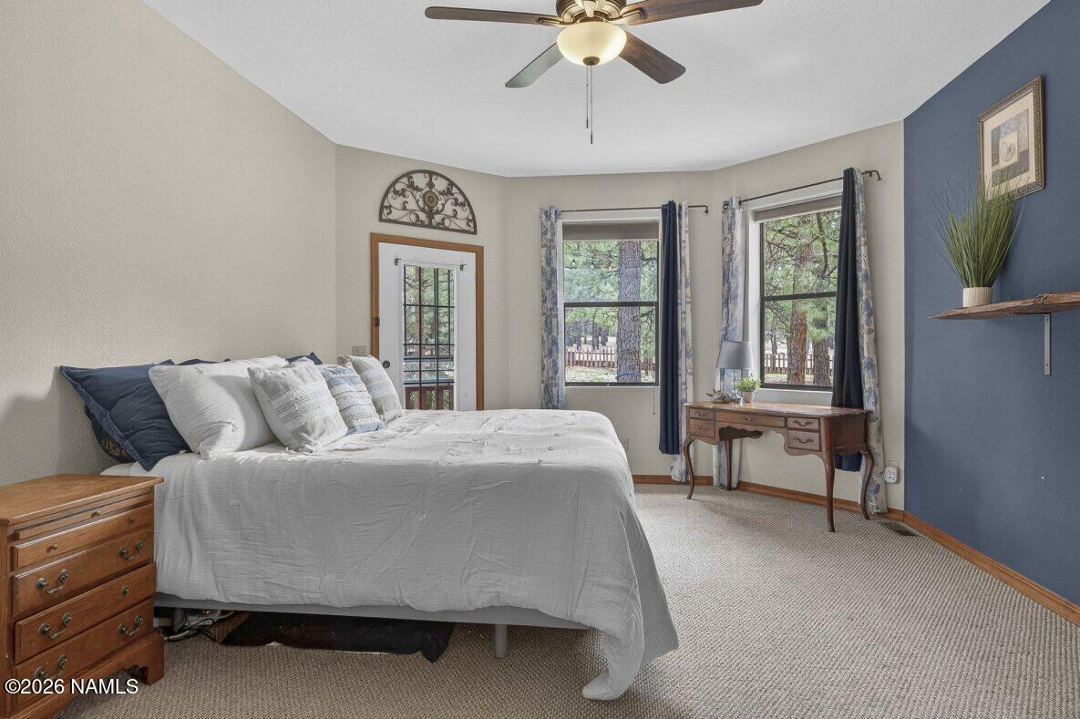 6135 East Abbey Road Flagstaff, AZ 86004 - Photo 15 of 48 Main Level Primary Bedroom with views Ga