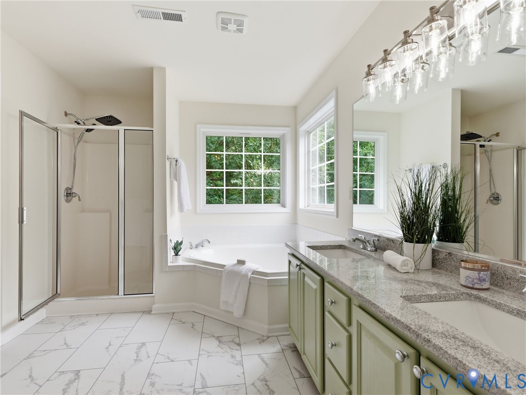 5707 Stephens Point Court Chester, VA 23831 - Photo 29 of 39 Primary Bath featuring a corner soaking tub with t