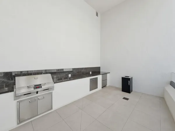 a view of swimming pool with outdoor seating and city view