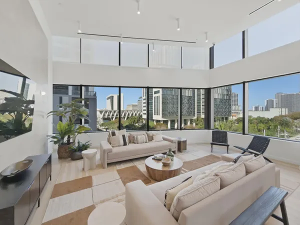 a living room with furniture and a large window